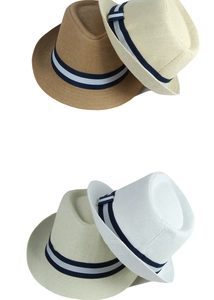 Detail of diverse straw fedora hats featuring stylish blue and white striped ribbon bands