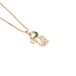Elegant gold fox pendant necklace with green gemstone eyes and sparkling zircons for women