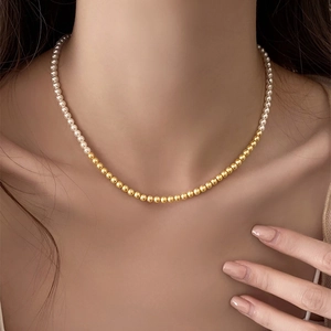 French vintage beaded pearl necklace with gold metal beads on female model