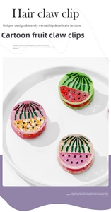 Close-up of fruit-shaped acetate hair claw clips with lemon and watermelon designs