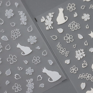 3D embossed nail stickers featuring white matte cats and cherry blossoms with adhesive