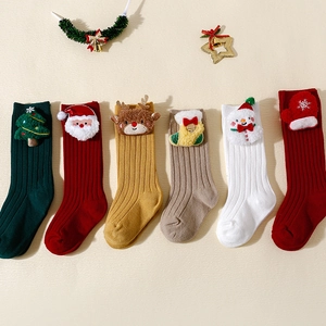 Christmas socks for kids with 3D Santa and elk decorations in festive assorted colors