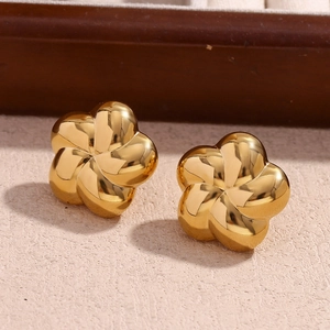 Macro shot of 18K gold plated petal earrings with shell texture and shimmering zircons