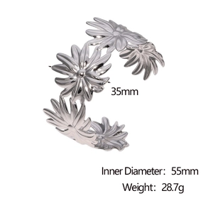 Detail view of silver floral open bangle with dimensions 35mm daisy and 55mm inner diameter
