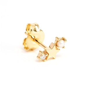 Detail view of gold star stud earring featuring a small white pearl and zircon stone