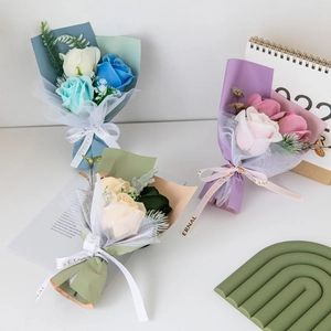 Three mini artificial soap flower bouquets in pink, blue and champagne for gift