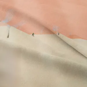 Detailed macro view of the soft knitted cotton fabric with a bohemian landscape print