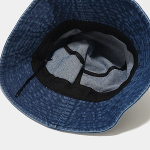 Deep blue denim bucket hat with internal adjustable strap and washed vintage texture