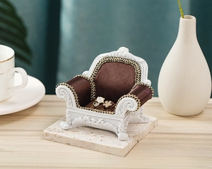 Miniature European vintage sofa jewelry display with pearl cat and flower rings on top