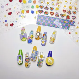 Macro detail of 5D embossed nail stickers featuring colorful 3D bows and floral patterns