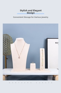 Detail of beige velvet jewelry display set with necklace bust and bracelet holder
