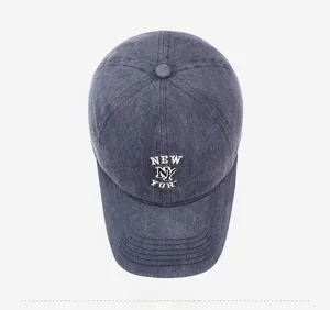 Top-down view of washed navy baseball cap with white embroidered New York NY lettering