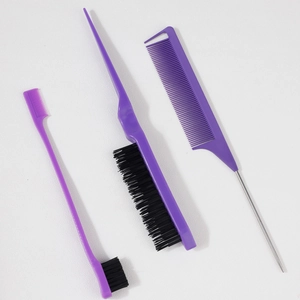 Macro view of purple hair styling kit including edge brush and metal tail combs