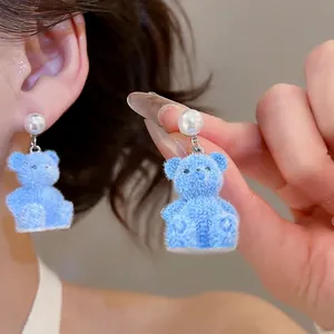 Blue flocked bear earrings with white pearl studs for a sweet and elegant aesthetic