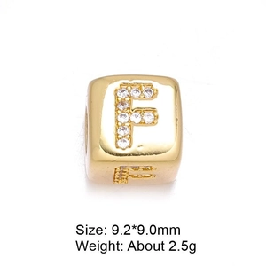 Detail view of 8mm gold letter F bead with micro-paved cubic zirconia for DIY jewelry