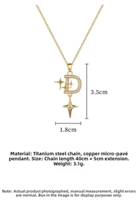Detailed view of D-letter pendant with star motif and crystals in titanium steel