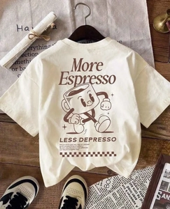 Flat lay of cream cotton t-shirt with More Espresso Less Depresso back print detail
