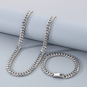 Detailed view of silver stainless steel 8mm Cuban link necklace and bracelet set