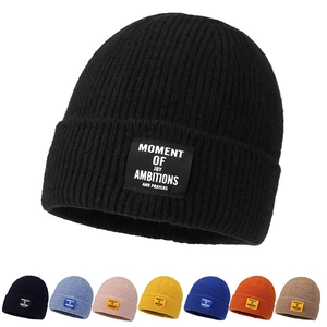 Unisex knit beanie in black and multiple colors with fashion letter patch for winter warmth
