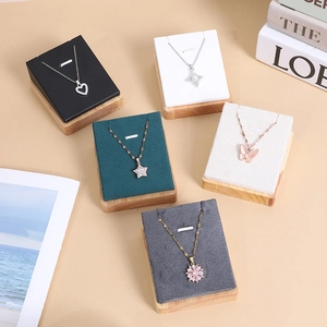 Multi-color jewelry display pads with wooden base for necklace and pendant showcase