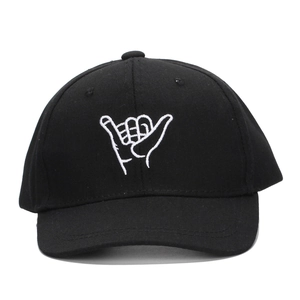 Kids black baseball cap featuring a white embroidered Shaka Hang Loose hand sign