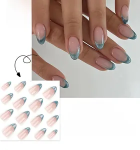Detail showing nude pink almond press-on nails with glittery blue French tips and layout