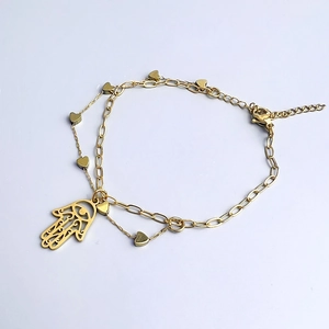 Detail of double-layer gold Hamsa Hand bracelet with heart pendants and OT clasp