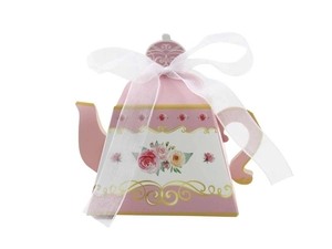 Detail of teapot-shaped candy box with pink rose pattern and white organza ribbon bow