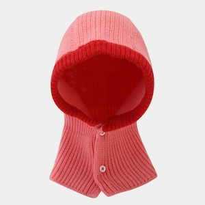 Detail of pink knitted balaclava showing ribbed texture and white buttons