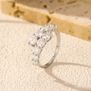 Polished S925 silver moissanite ring with sparkling gradient stones on stone surface
