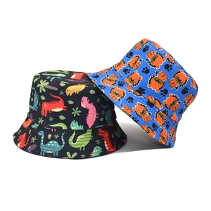 Dual-sided cotton bucket hats with colorful dinosaur and lion prints for sun protection
