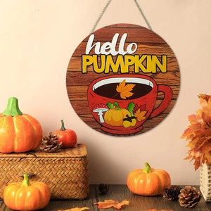 Detail of hello PUMPKIN wooden sign with coffee cup and autumn harvest decorative elements
