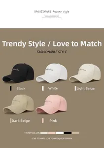 Detail showing various colors of embroidered cotton baseball caps with a curved brim