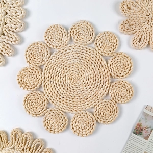 Bohemian light beige woven straw wall decor with spiral textures and petal edges