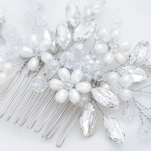 Exquisite bridal hair comb with silver finish, white faux pearls, and sparkling crystals