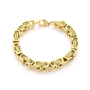 Gold Byzantine woven stainless steel bracelet for men with lobster clasp on white background