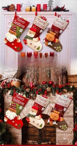 Close-up of three festive Christmas stockings with Santa, Snowman and Reindeer applique