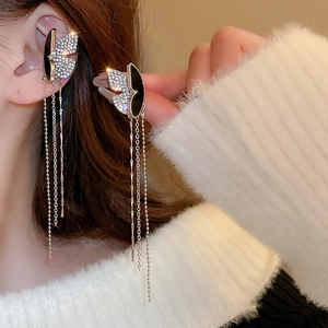 Vintage silver butterfly ear cuff with sparkling rhinestones and long tassel chains