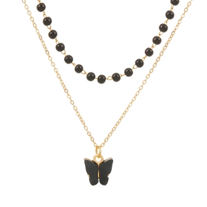 Gothic double-layered necklace featuring black beads and a butterfly pendant on gold chain