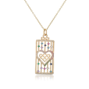Macro detail of 18K gold-plated rectangle pendant with colorful zircon and heart pattern