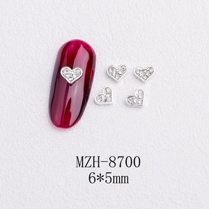 Detailed view of silver heart nail charms 6x5mm for DIY manicure art decoration