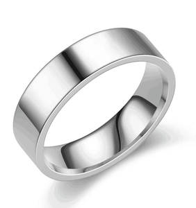 Macro shot of polished stainless steel minimalist ring with a reflective silver finish