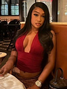 Chic red deep V-neck halter top with pleated fabric for a stylish summer look