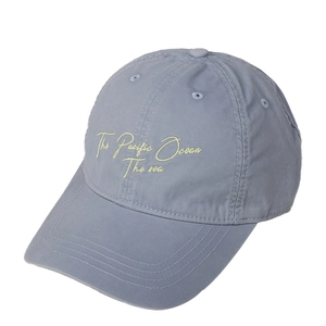 Classic blue cotton baseball cap with The Pacific Ocean yellow embroidery on front