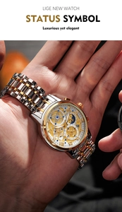 Close-up of luxury men's quartz watch with gold steel strap and moon phase dial detail