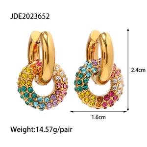 Macro detail of gold-plated hoop earrings with colorful crystals and dimensions