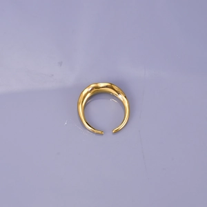 Detailed view of the gold irregular streamlined texture and adjustable open ring design