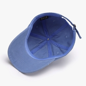Blue washed cotton baseball cap with adjustable metal buckle and breathable interior