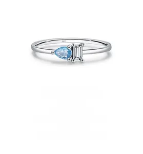 Detailed close-up of S925 silver ring featuring blue teardrop and rectangle crystals