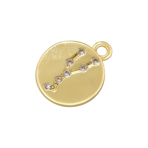 Detailed view of a gold zodiac pendant featuring cubic zirconia constellation patterns